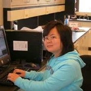 Miao Duo typing on a computer