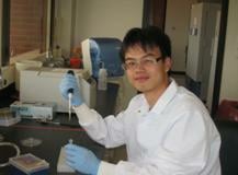 Huiqing Zheng holding a pipette