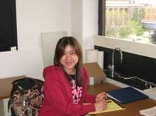 Judy Ng sitting at a desk