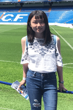 Jianqiu Jiang posing on a turf field
