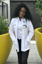 Osatohanmwen Onaghinor posing in a lab coat
