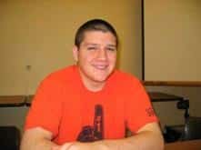 Elden Swidell sitting at a desk