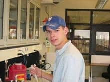Timothy Gosert working in the Ren lab